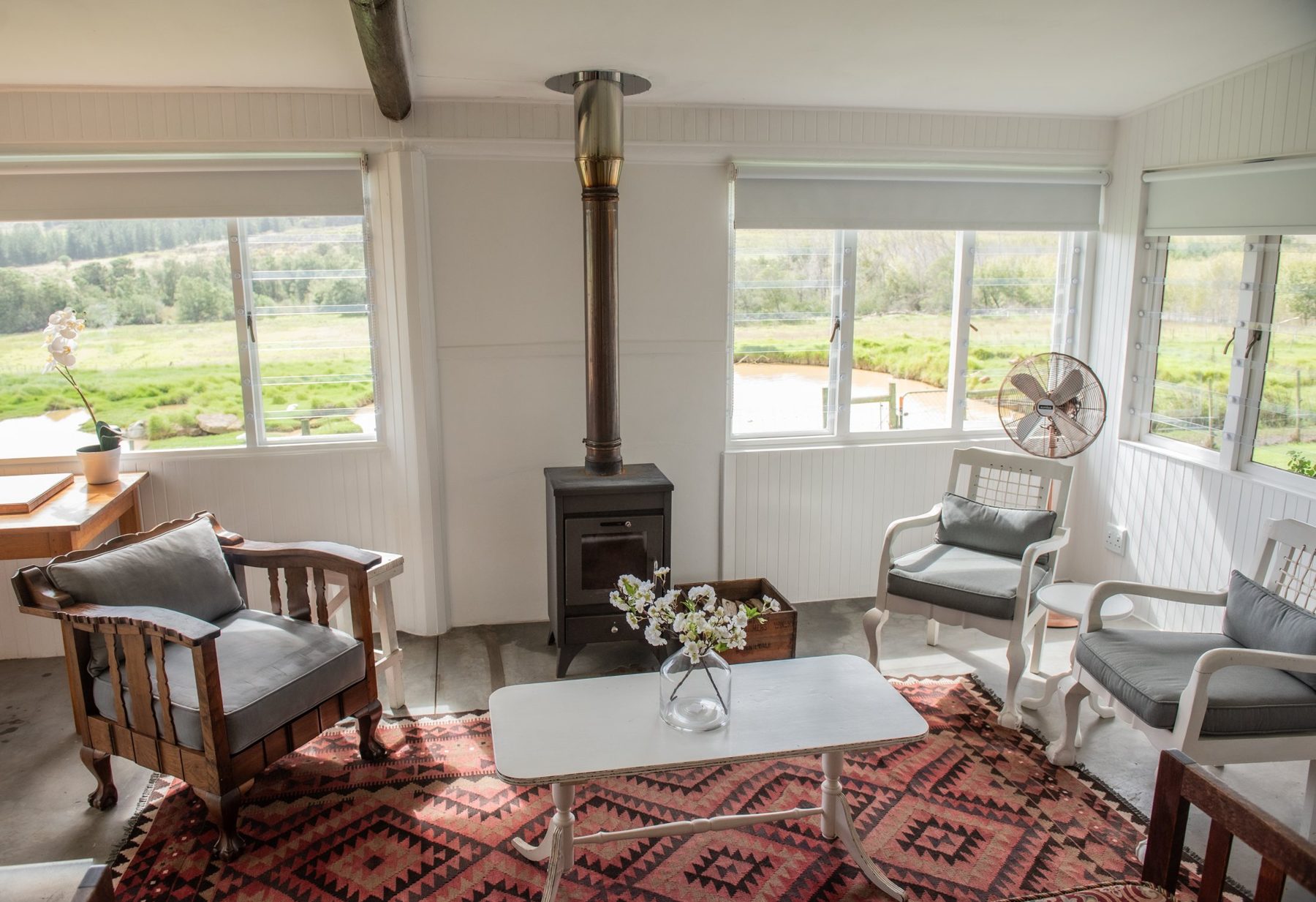 Duck Pond — living room with wood stove at Landmeterskop Farm Cottages