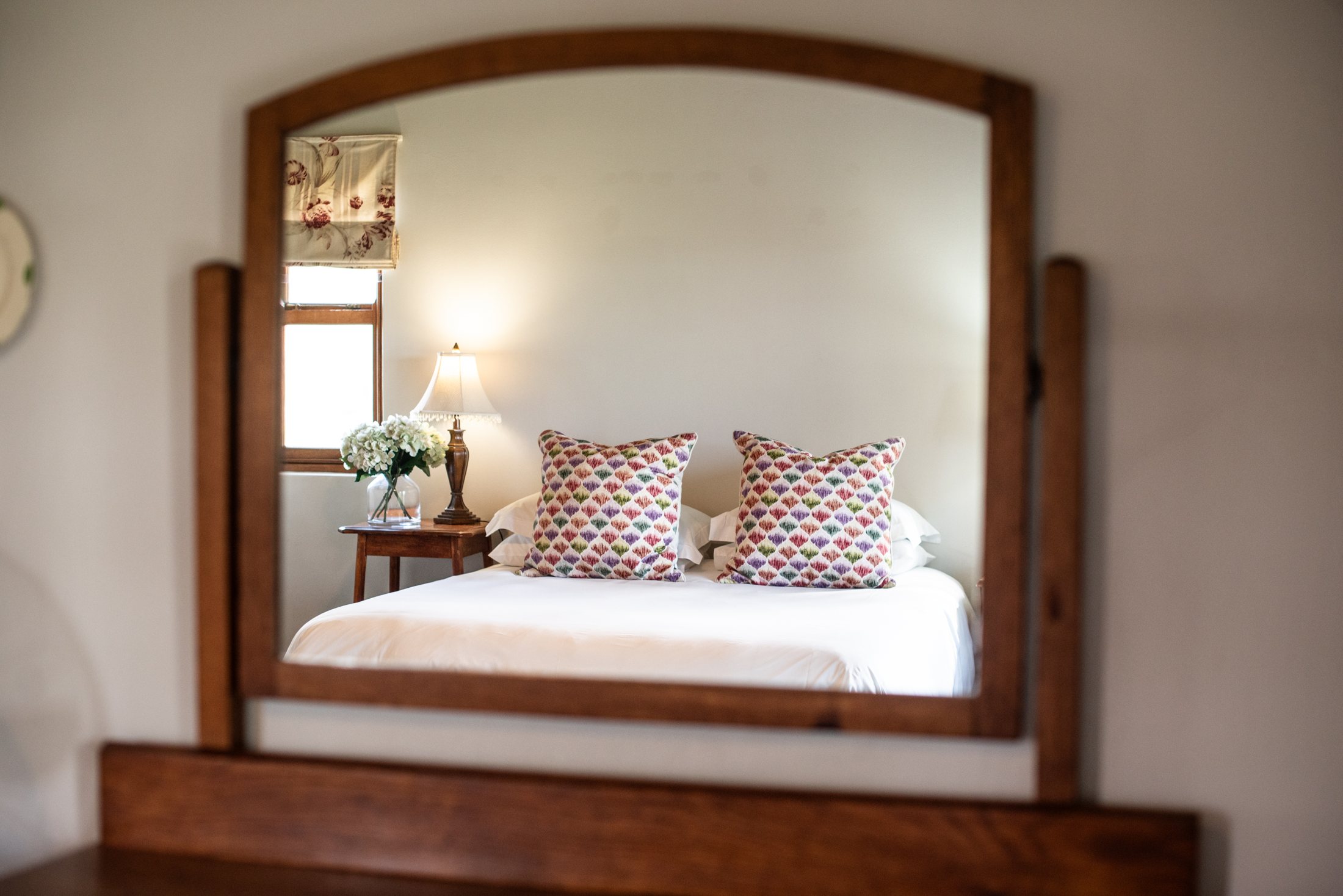 Merino — double bedroom and mirror at Landmeterskop Farm Cottages