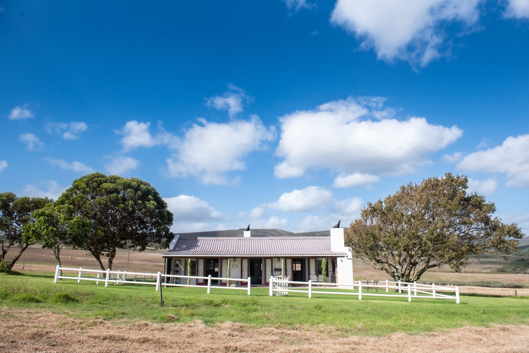Merino — cottage exterior in its farm setting at Landmeterskop Farm Cottages