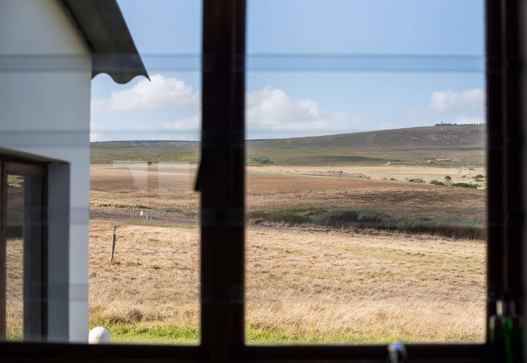 Dormer — farm view toward the cottage at Landmeterskop Farm Cottages