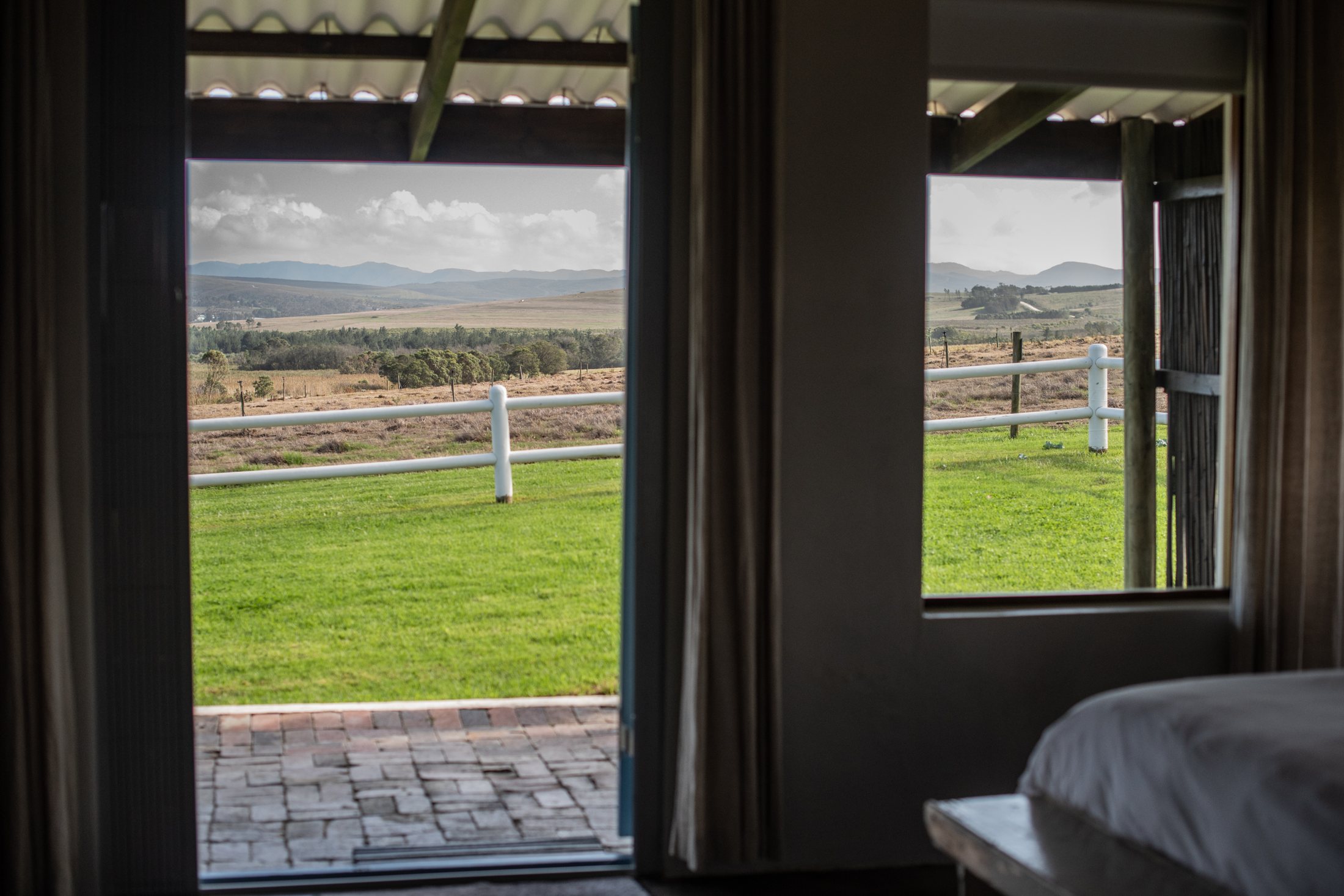 Dormer — bedroom opening to the veranda at Landmeterskop Farm Cottages