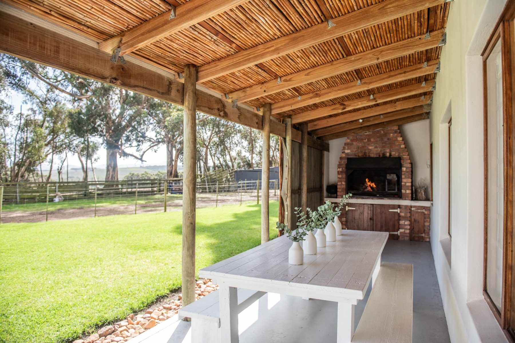 Karakul — veranda and outdoor fireplace at Landmeterskop Farm Cottages