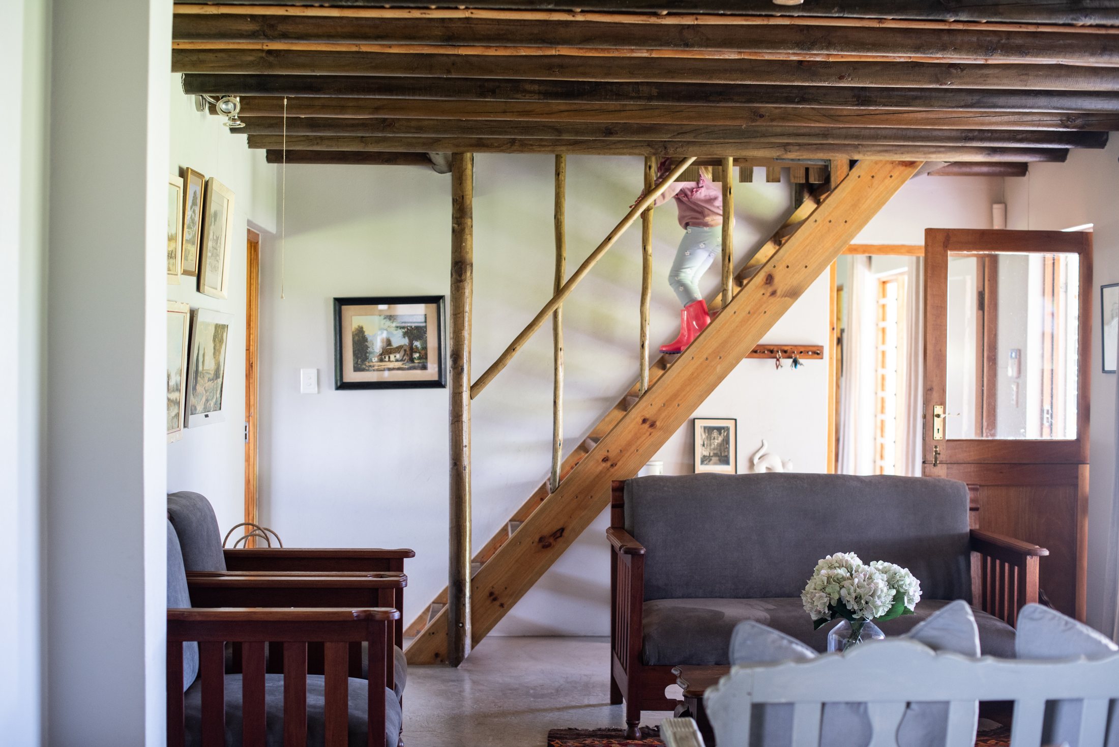 Karakul — living room and staircase at Landmeterskop Farm Cottages